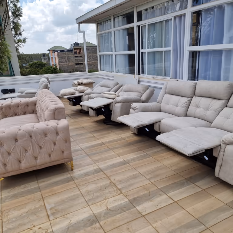 Row of freshly cleaned beige sofas drying on a Nairobi rooftop after upholstery cleaning