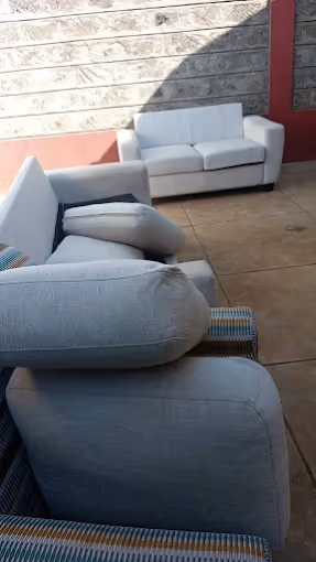 Freshly cleaned living room with polished floors and tidy furniture in a Nairobi home